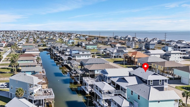 birds eye view of property featuring a residential view and a water view