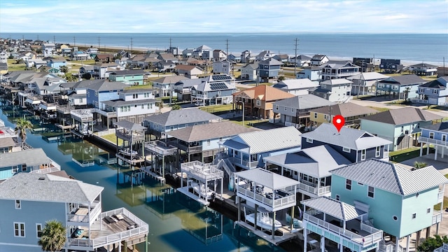 bird's eye view featuring a water view and a residential view