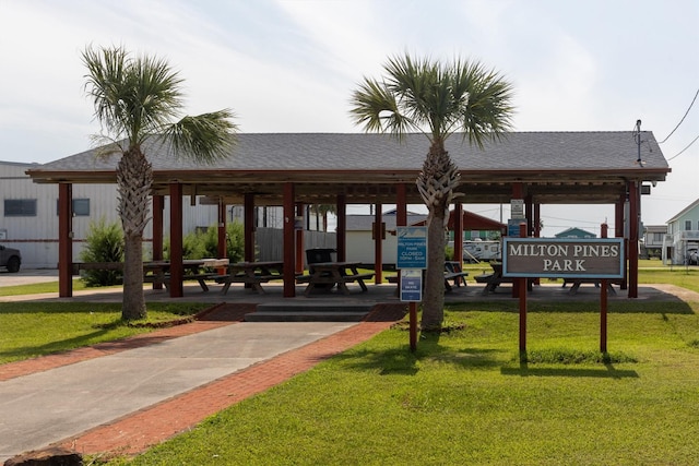 surrounding community with a gazebo and a yard