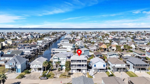 birds eye view of property featuring a residential view and a water view