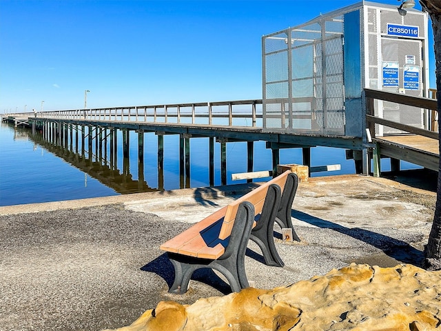 view of dock featuring a pier and a water view