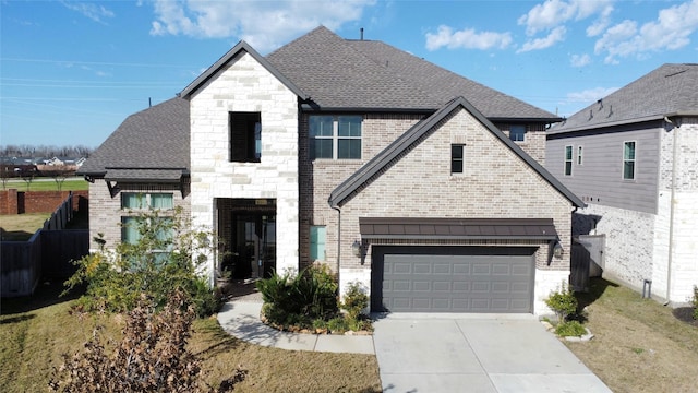 french country home with brick siding, fence, a shingled roof, driveway, and an attached garage