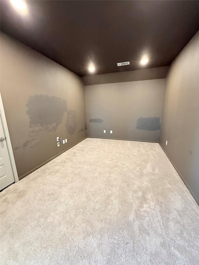 spare room featuring carpet