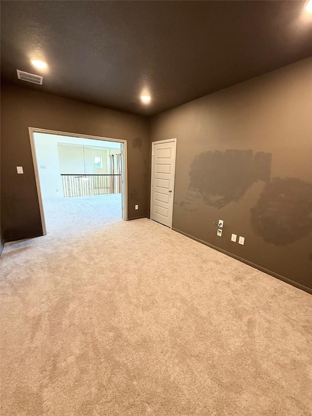 unfurnished room with carpet floors