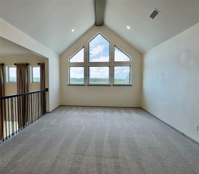 additional living space with light colored carpet, visible vents, lofted ceiling with beams, and baseboards