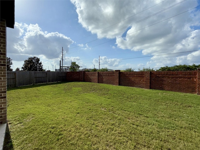 view of yard with a fenced backyard