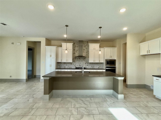 kitchen featuring stainless steel microwave, a large island, oven, wall chimney exhaust hood, and dark countertops