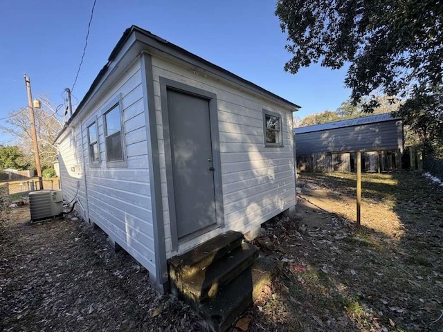 view of outbuilding featuring entry steps and central AC