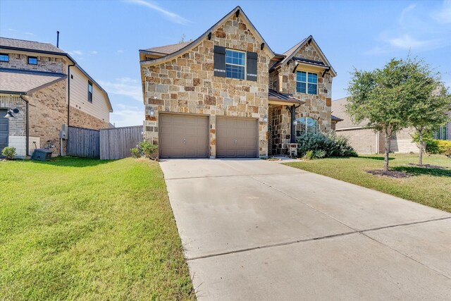 view of front of house featuring a front yard and a garage