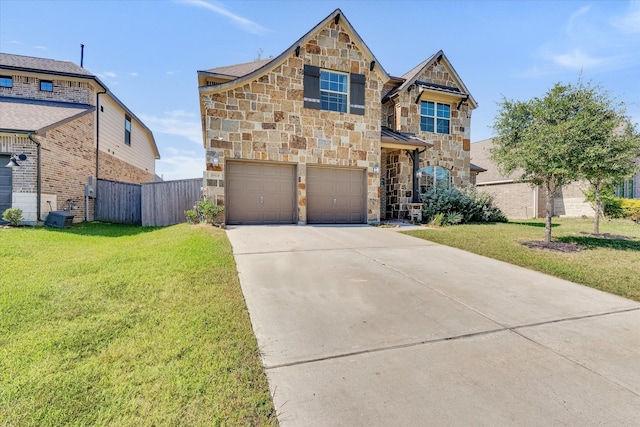 view of front facade with a garage and a front lawn