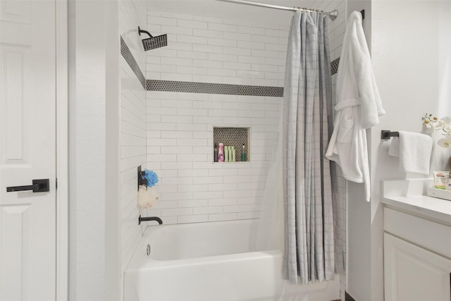 bathroom featuring vanity and shower / bath combo with shower curtain