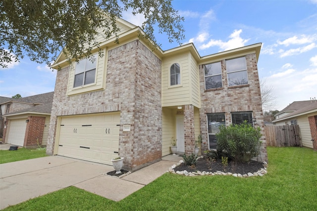 view of front of home with a garage and a front yard