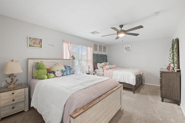 bedroom featuring light carpet and ceiling fan