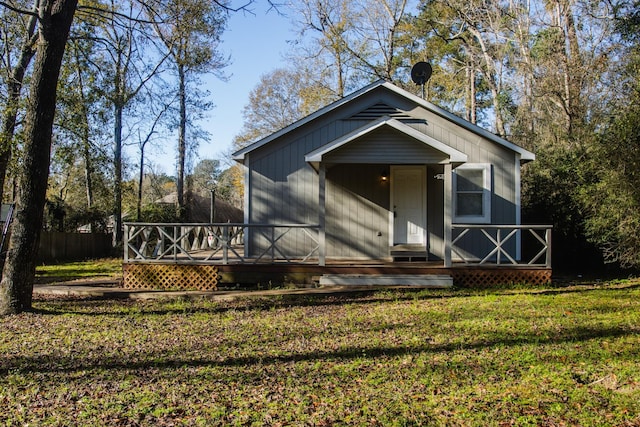 bungalow-style house featuring a front yard