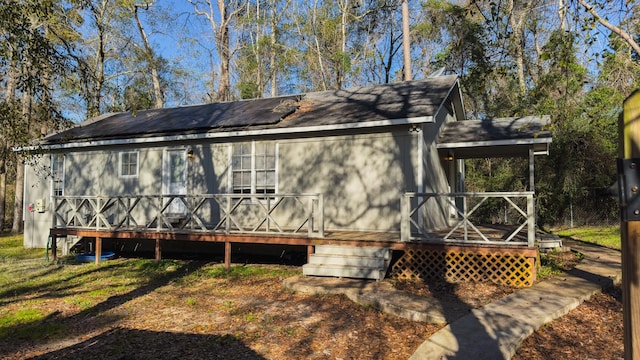 exterior space featuring a wooden deck