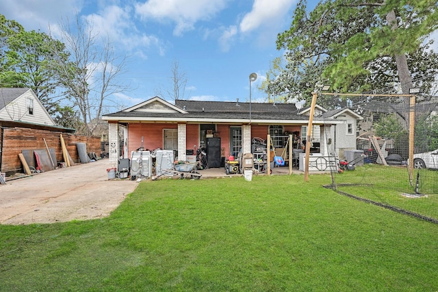 rear view of house with a lawn