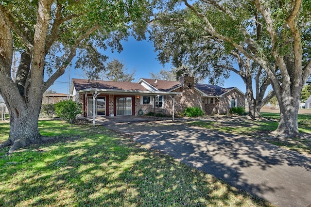 ranch-style house with a front lawn