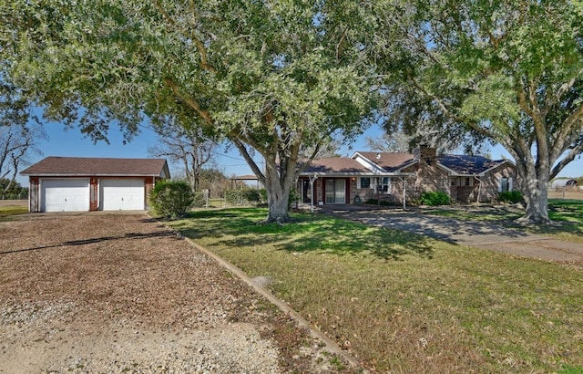 single story home with a front yard and a garage