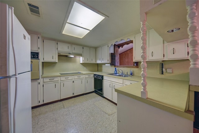 kitchen featuring black appliances, white cabinets, and sink