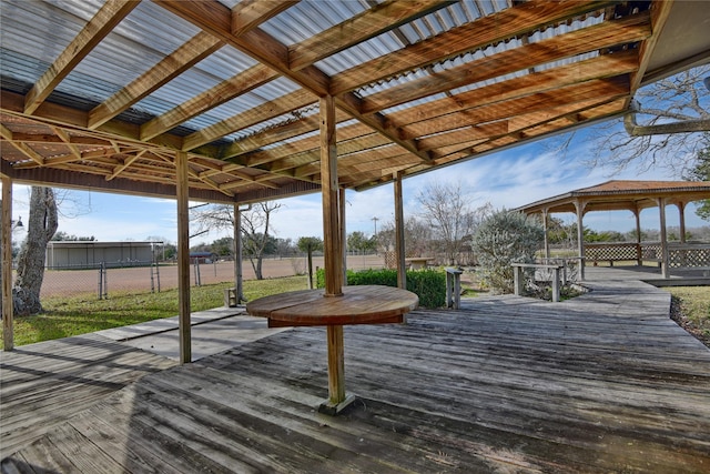 wooden terrace featuring a gazebo