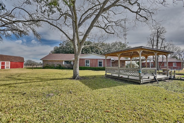 view of yard featuring a gazebo and a deck