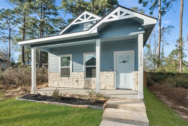 view of front of property featuring covered porch