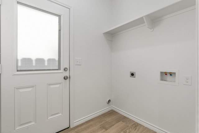 washroom featuring hookup for a washing machine, hookup for an electric dryer, and light wood-type flooring