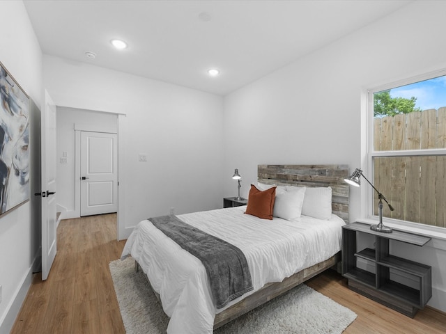 bedroom with light hardwood / wood-style floors