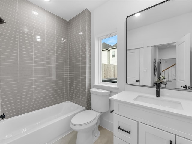 full bathroom featuring toilet, vanity, and bathing tub / shower combination