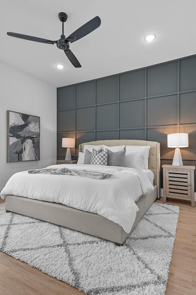 bedroom featuring ceiling fan and light hardwood / wood-style floors