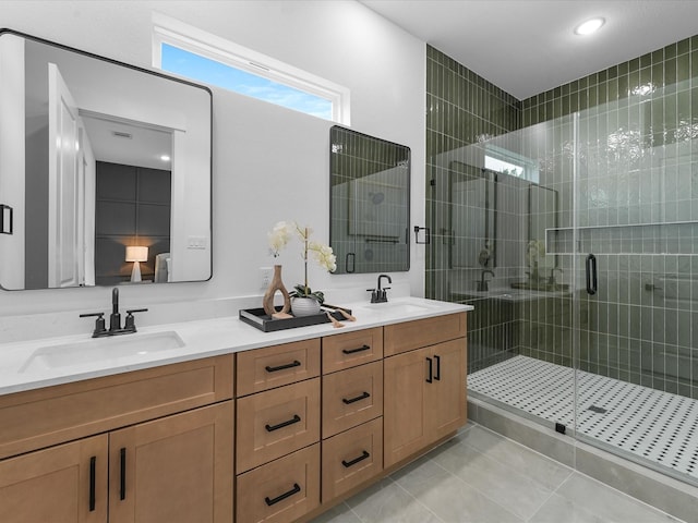 bathroom featuring vanity, tile patterned floors, and a shower with door