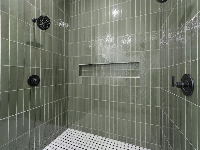 bathroom with a tile shower