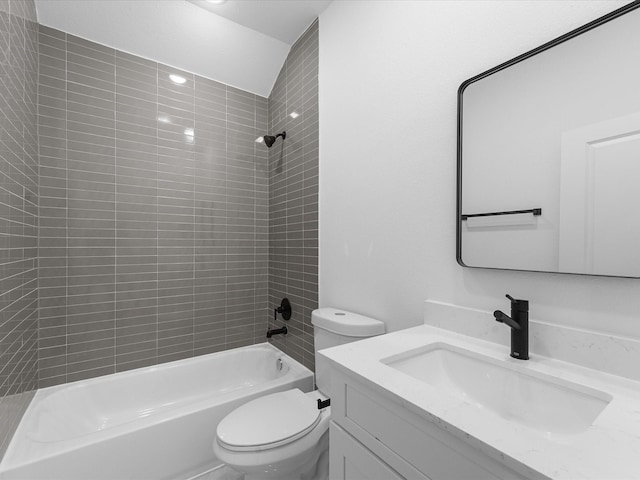 full bathroom with toilet, tiled shower / bath combo, and vanity