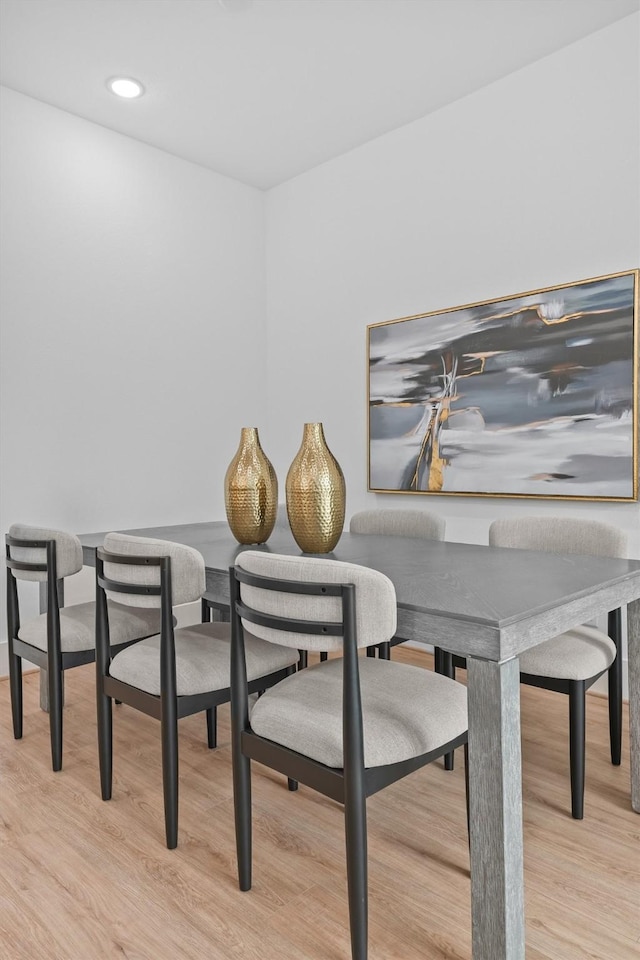 dining space featuring light wood-type flooring