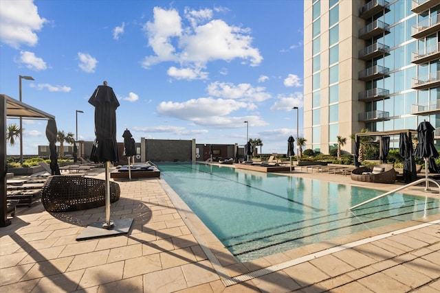 view of swimming pool featuring a patio