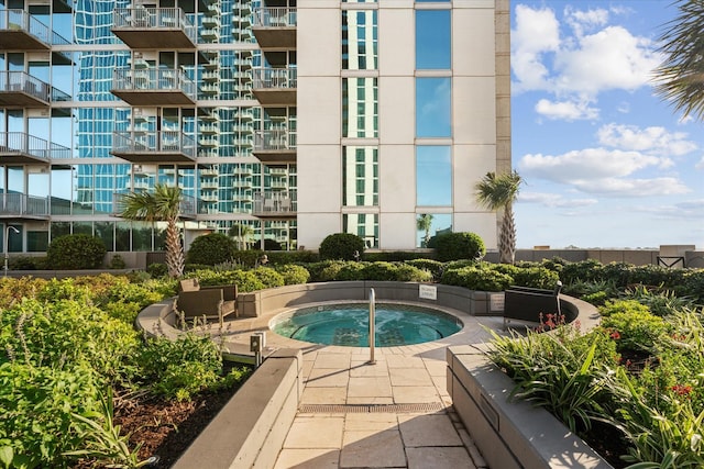 view of pool featuring a hot tub