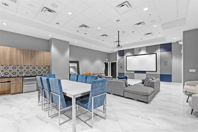 home theater featuring a drop ceiling and a towering ceiling