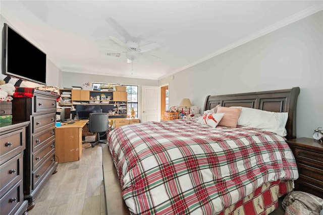 bedroom featuring ceiling fan, light wood-type flooring, and crown molding