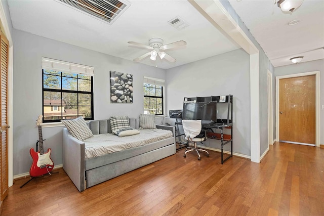 bedroom featuring ceiling fan and hardwood / wood-style flooring