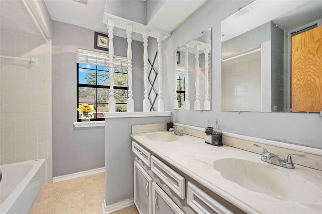 bathroom featuring vanity, tiled shower / bath combo, and tile patterned floors