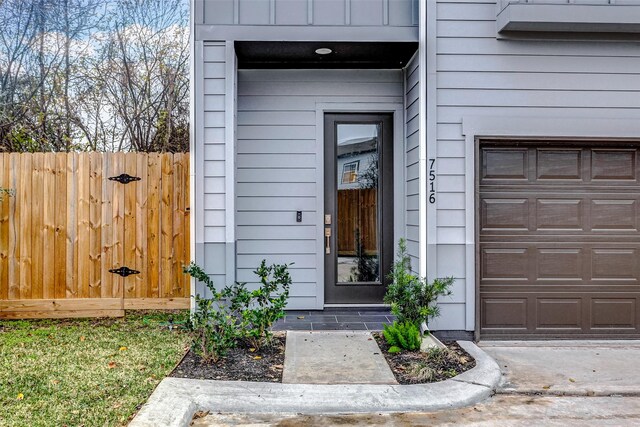 property entrance with a garage