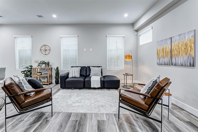 living room with light hardwood / wood-style floors