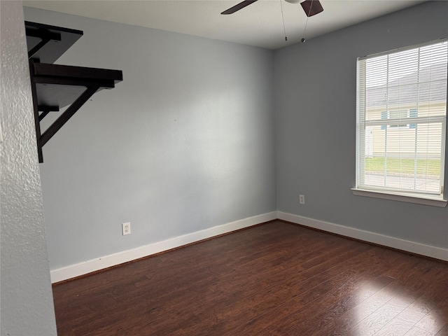 unfurnished room featuring ceiling fan, plenty of natural light, and dark hardwood / wood-style flooring