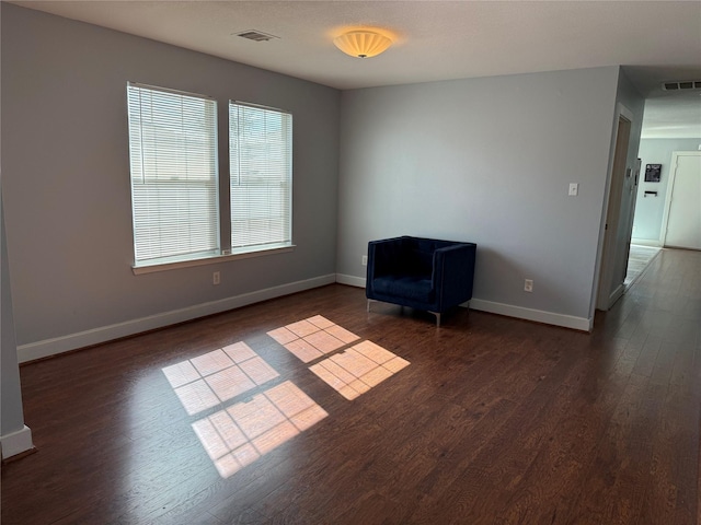 unfurnished room featuring dark hardwood / wood-style flooring