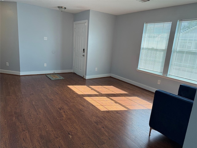 unfurnished room featuring wood-type flooring