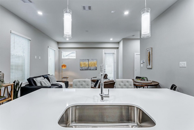 kitchen with sink and hanging light fixtures