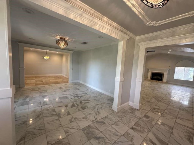 spare room featuring a notable chandelier and ornamental molding