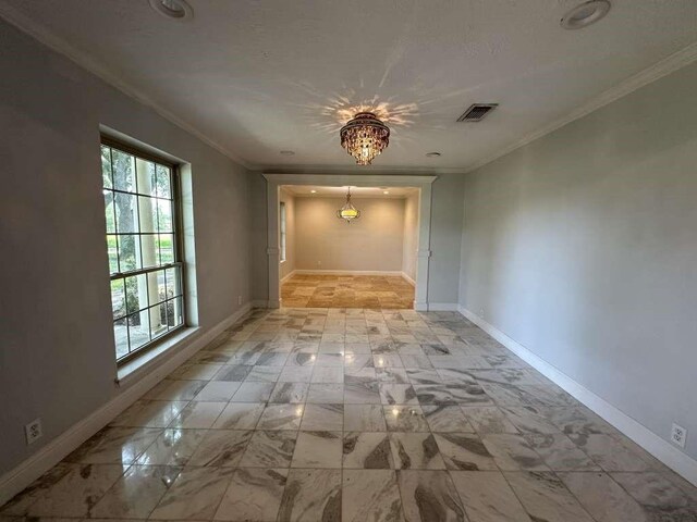 interior space featuring crown molding and a notable chandelier