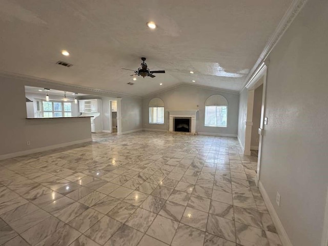 unfurnished living room featuring ceiling fan, crown molding, and lofted ceiling