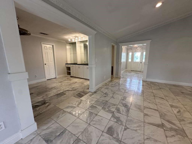 interior space with ornamental molding and lofted ceiling